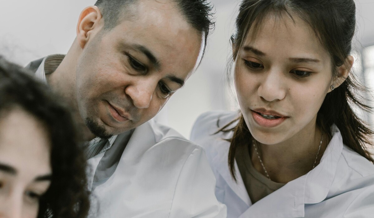 A preceptor and learners review a text